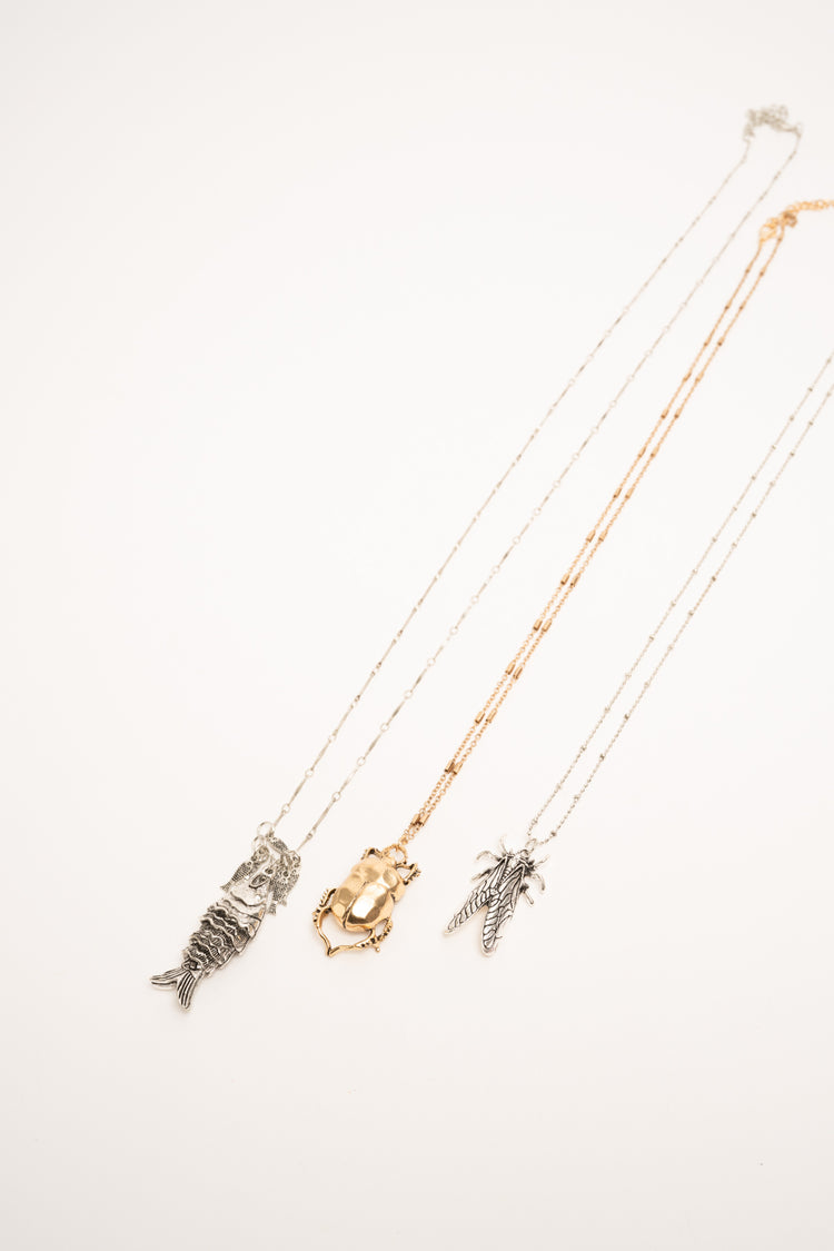 Set of three golden and silver Beetle pendant necklaces