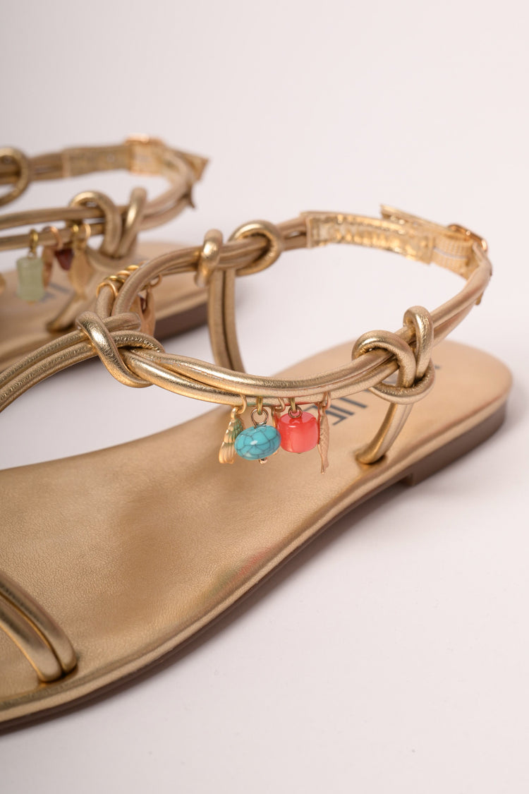 Charms detail golden flat sandals