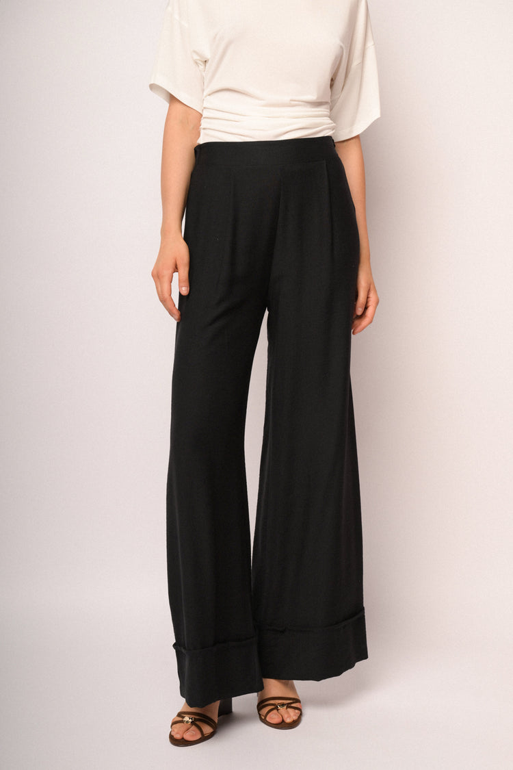 Black palazzo trousers with turn-up hem