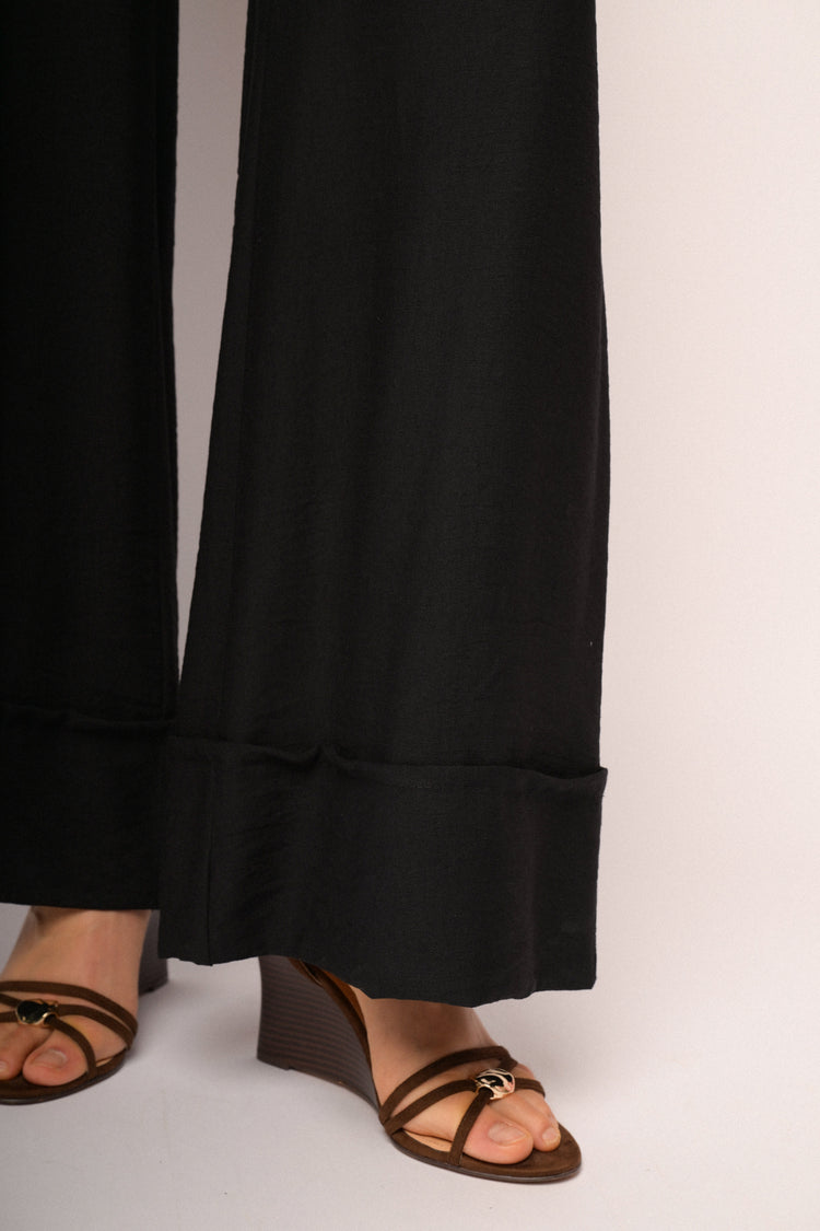 Black palazzo trousers with turn-up hem