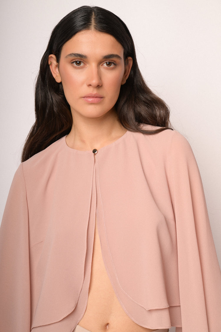 Pink bolero with button and cape sleeves