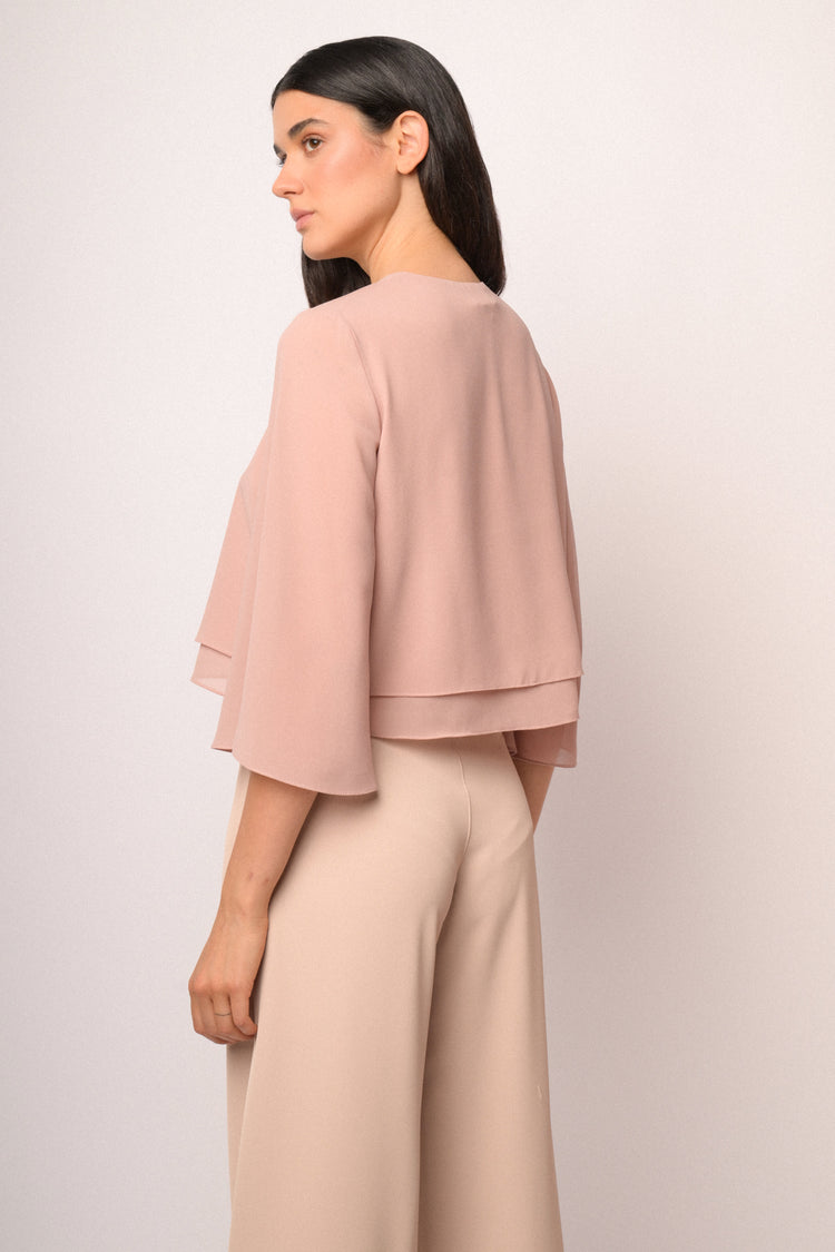 Pink bolero with button and cape sleeves