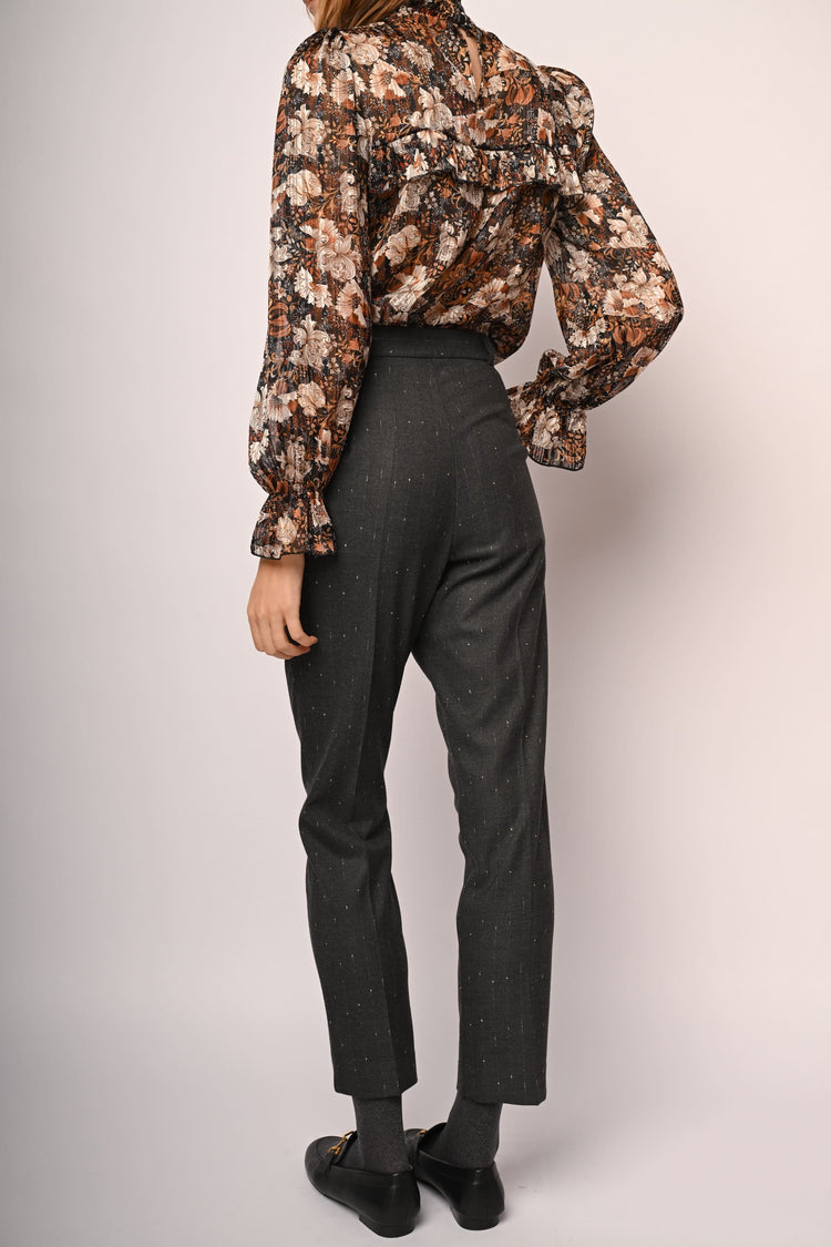 Laminated pinstriped trousers