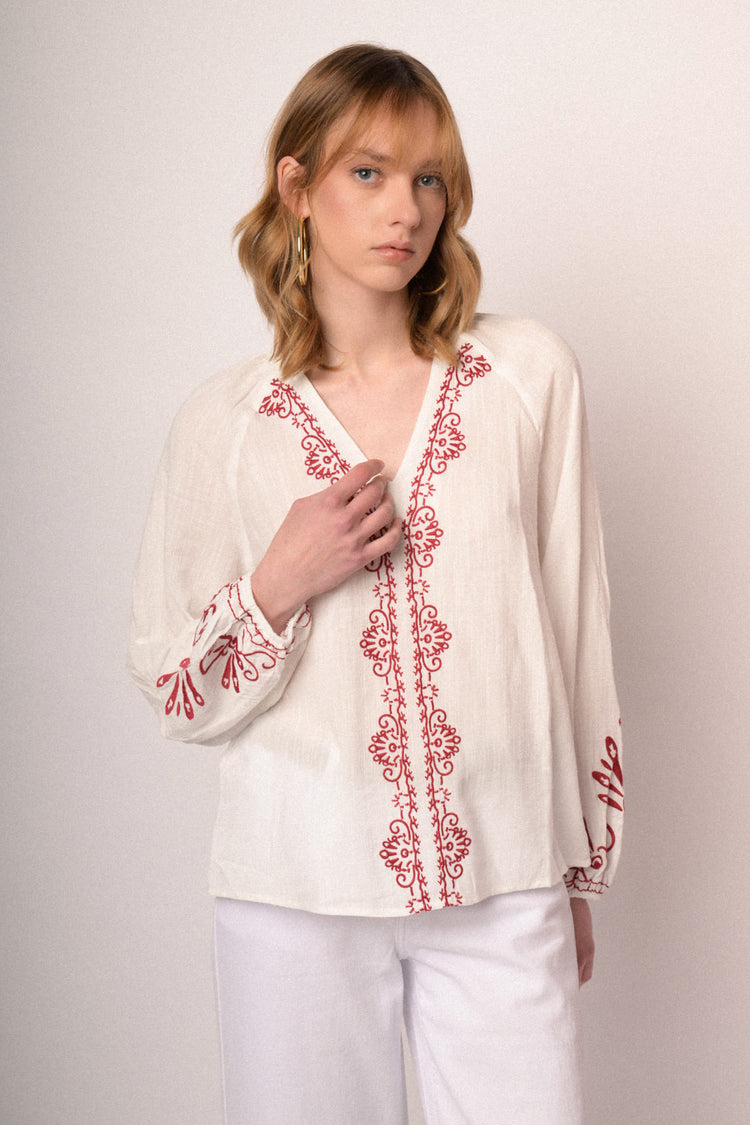 Red embroidered white cotton and viscose blouse