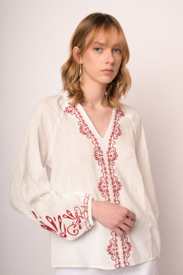 Red embroidered white cotton and viscose blouse
