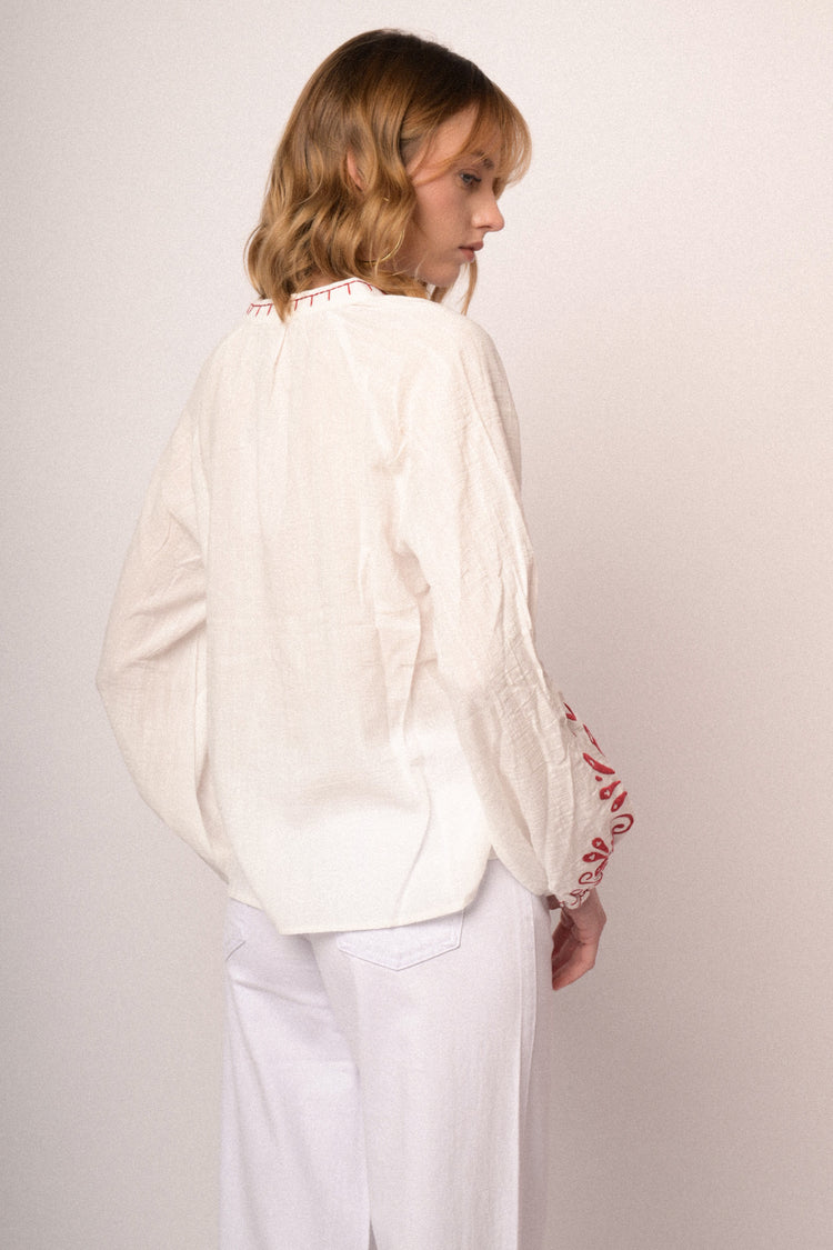 Red embroidered white cotton and viscose blouse