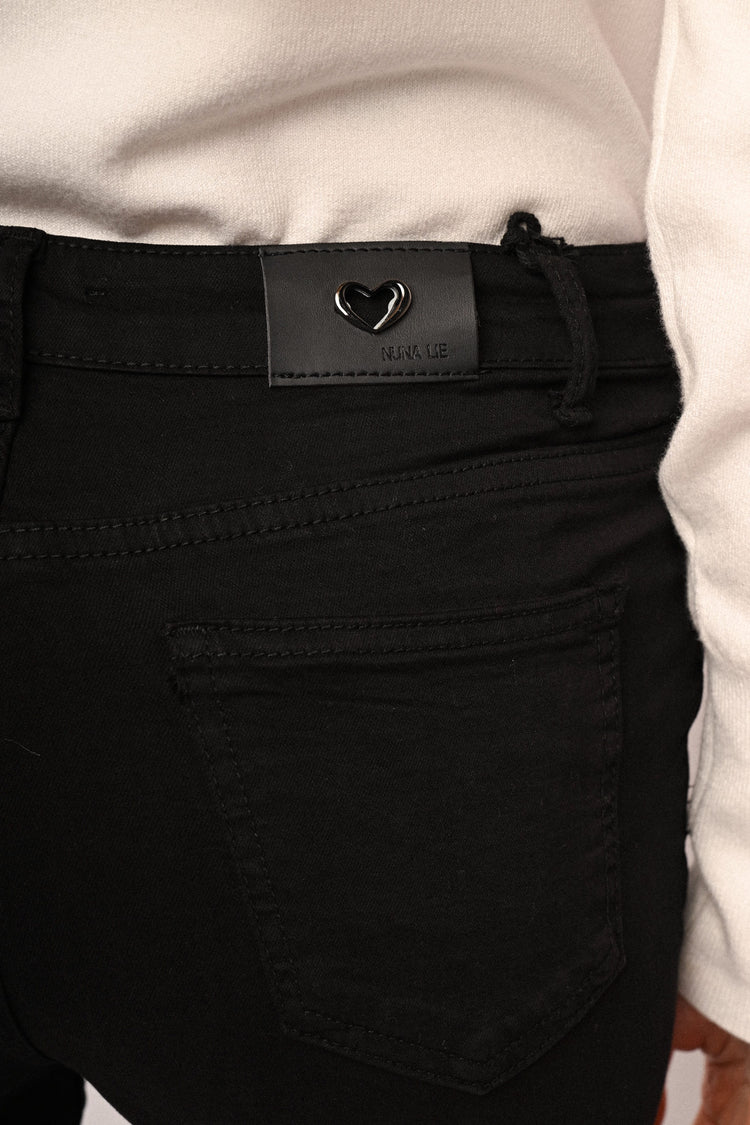 Pantaloni con bottoni gioiello