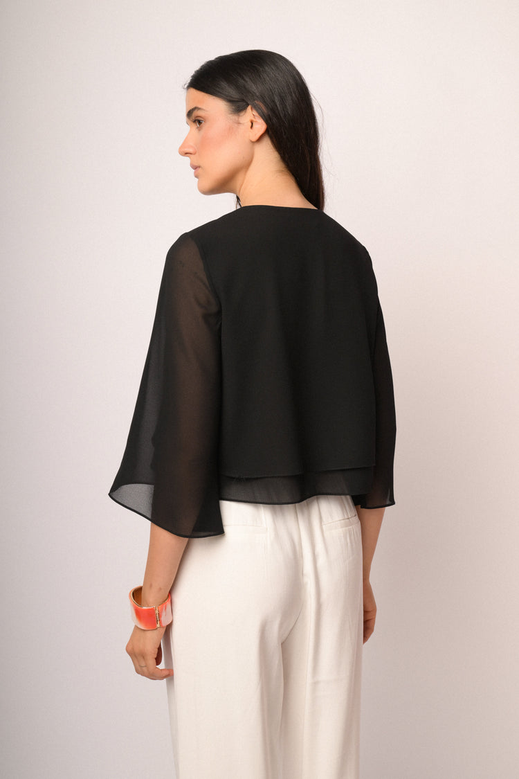 Black shrug with button and cape sleeves
