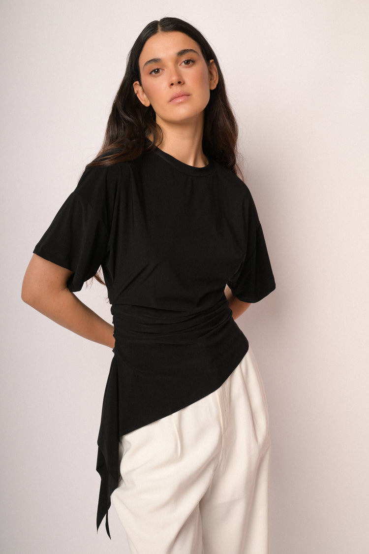 Black top with gathered detail and asymmetric hem