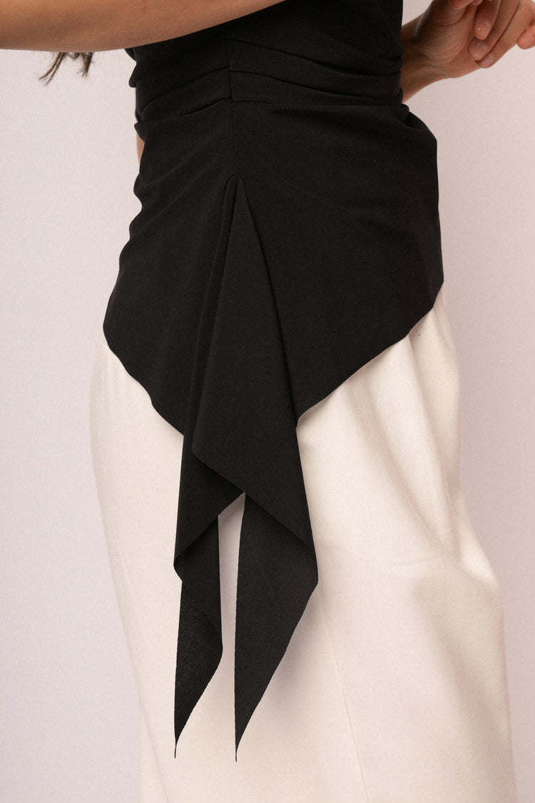 Black top with gathered detail and asymmetric hem