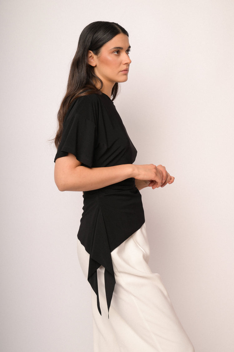 Black top with gathered detail and asymmetric hem