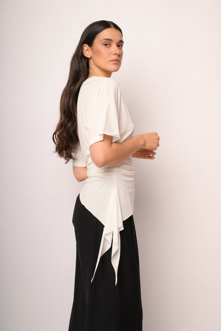 Ivory top with gathered detail and asymmetric hem