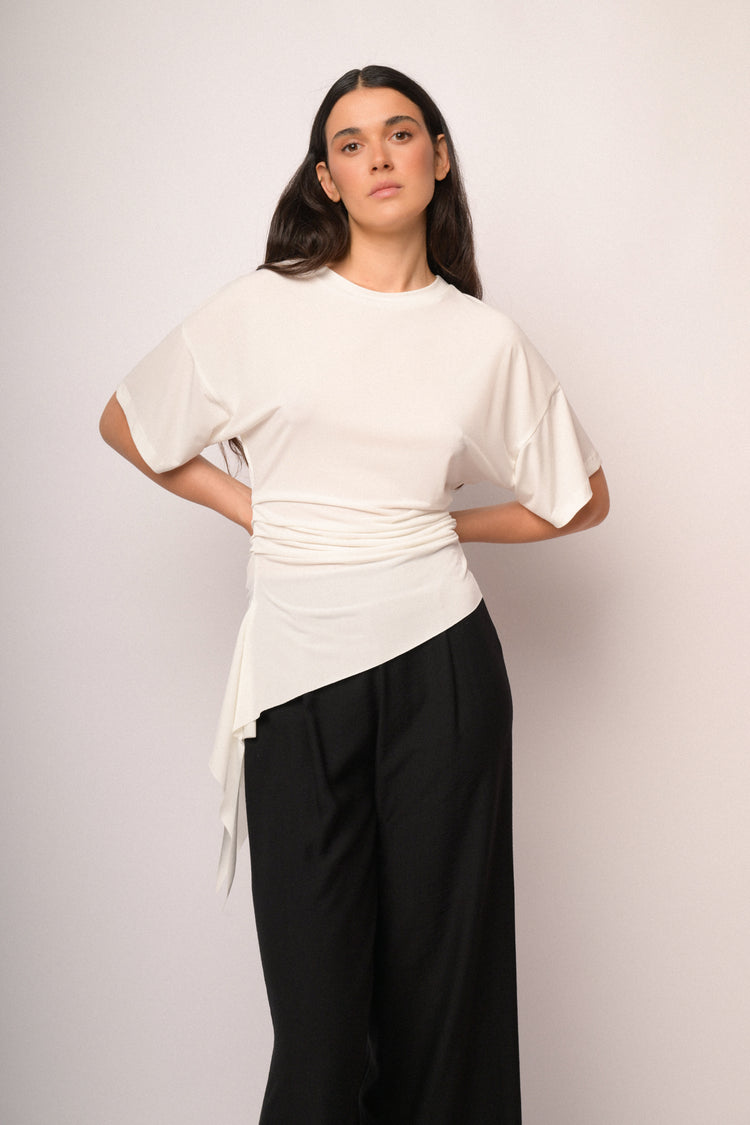 Ivory top with gathered detail and asymmetric hem