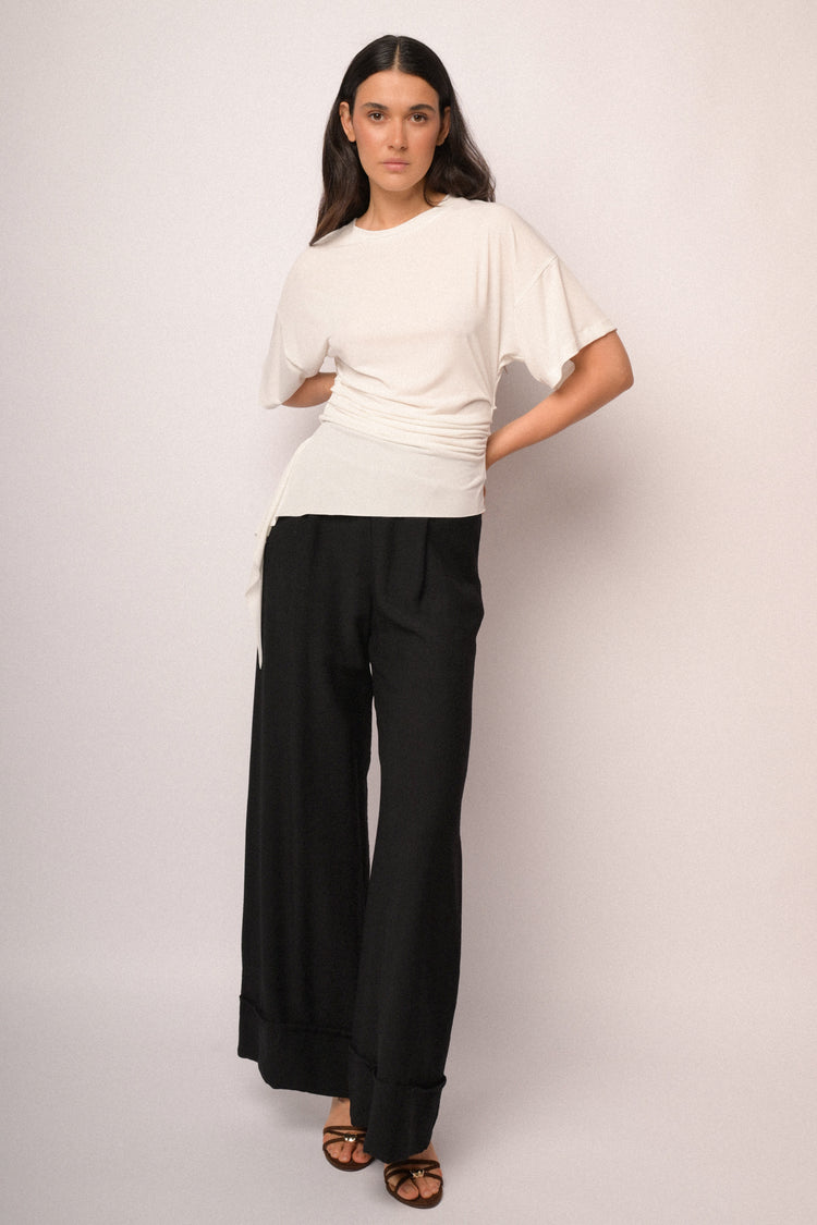 Ivory top with gathered detail and asymmetric hem