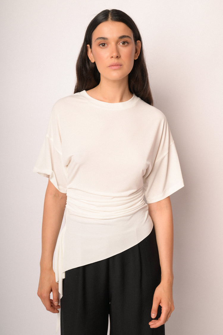 Ivory top with gathered detail and asymmetric hem