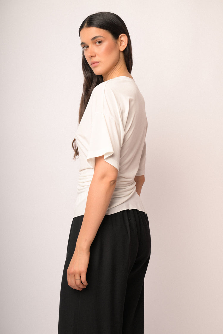 Ivory top with gathered detail and asymmetric hem