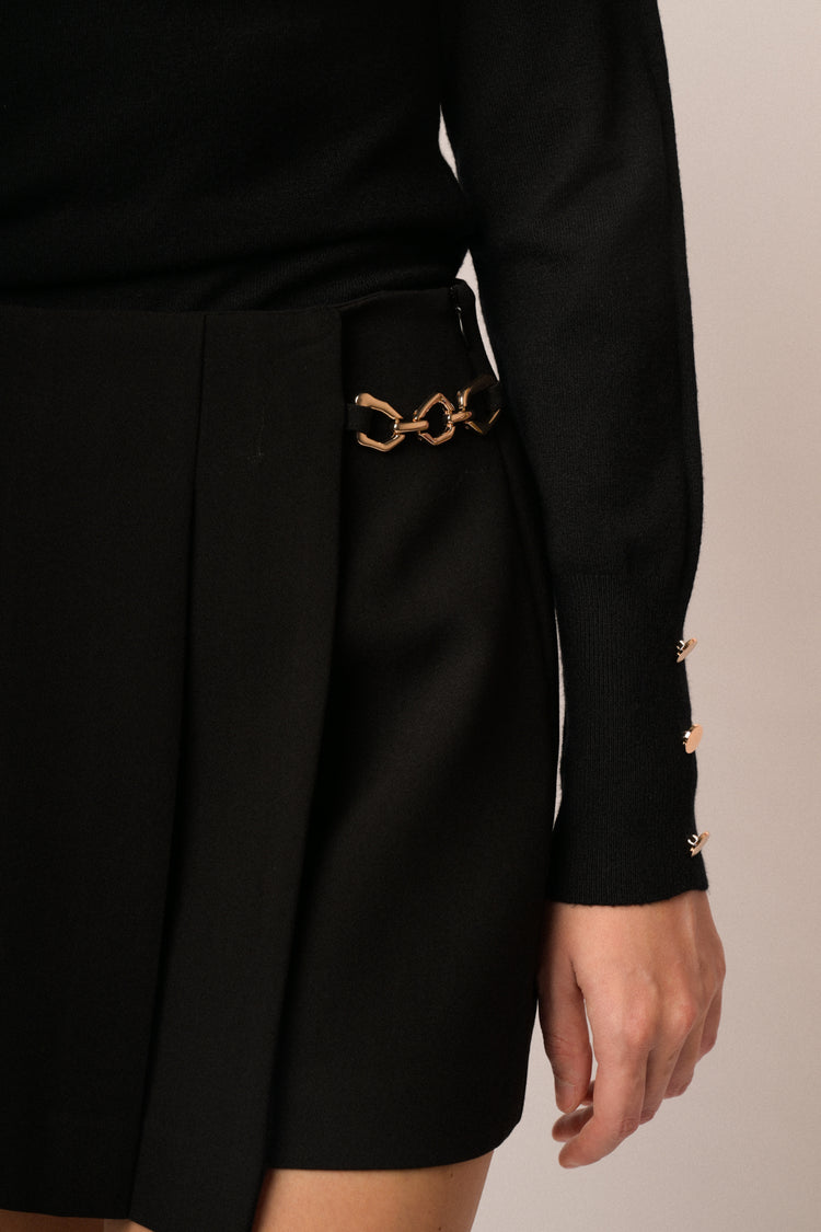 Black skort with gold-tone detail