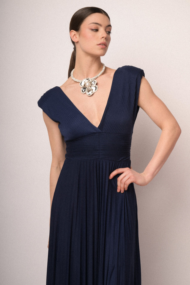 Navy blue pleated fabric gown