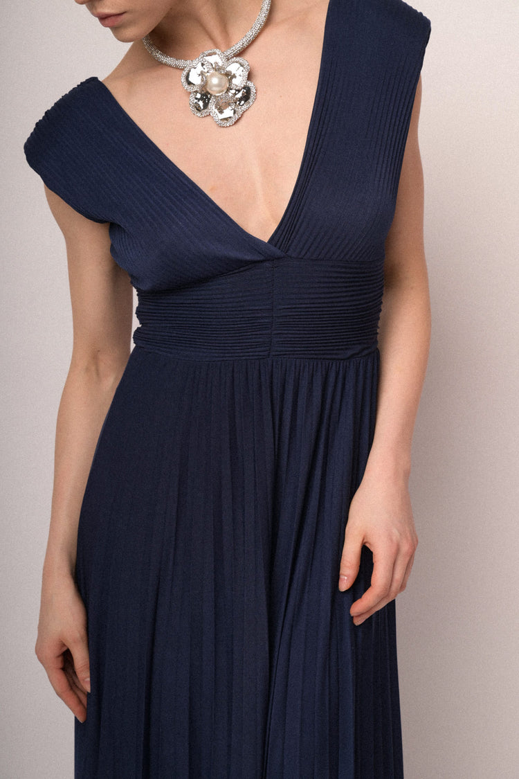 Navy blue pleated fabric gown