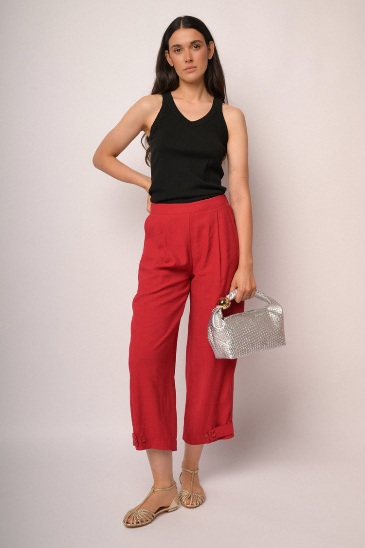 Red cropped trousers with hem buttons