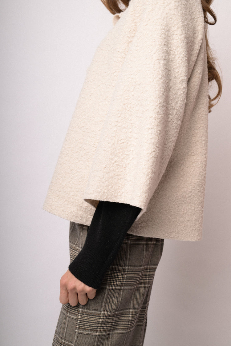 Beige short cape with high collar