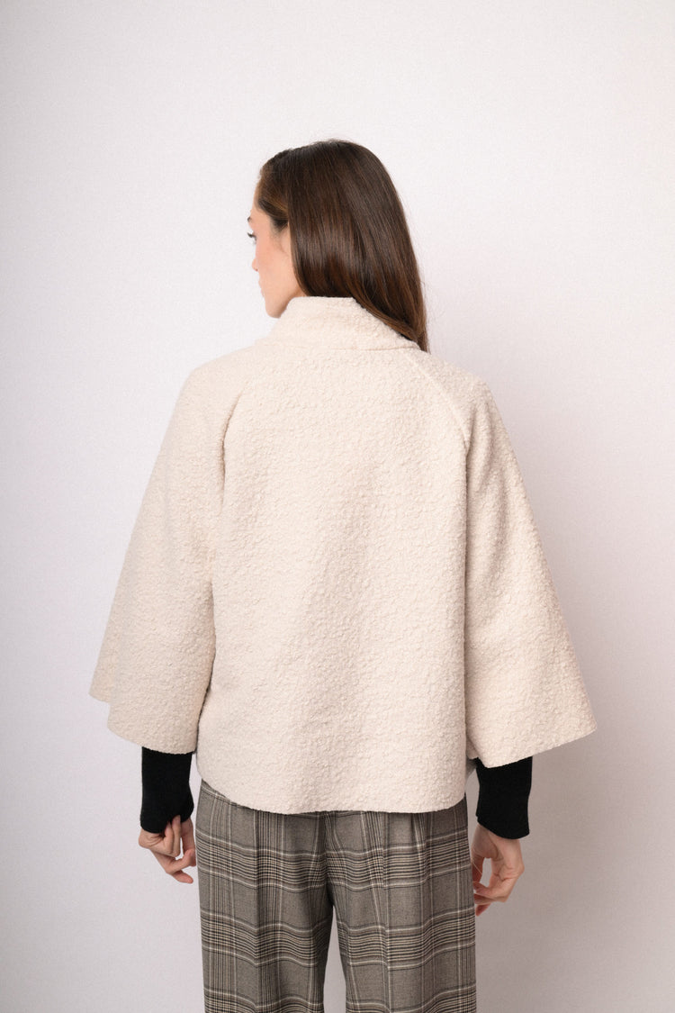 Beige short cape with high collar