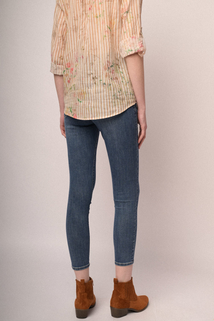 Blue denim button-fly skinny jeans