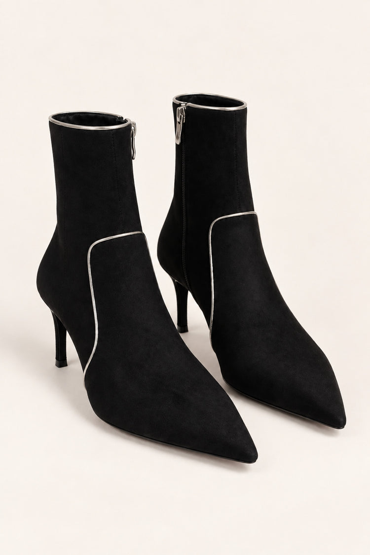 Black ankle boots with gold-tone piping