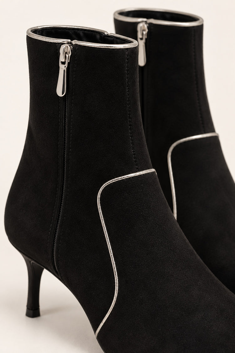 Black ankle boots with gold-tone piping