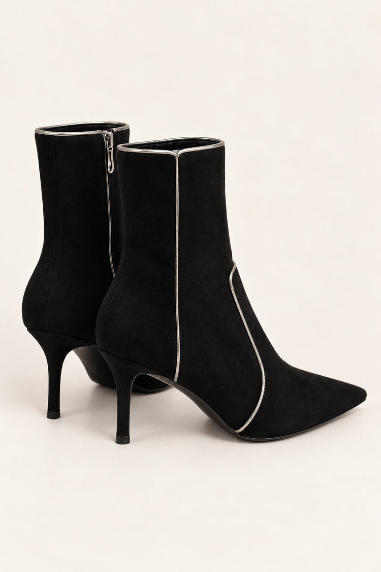 Black ankle boots with gold-tone piping