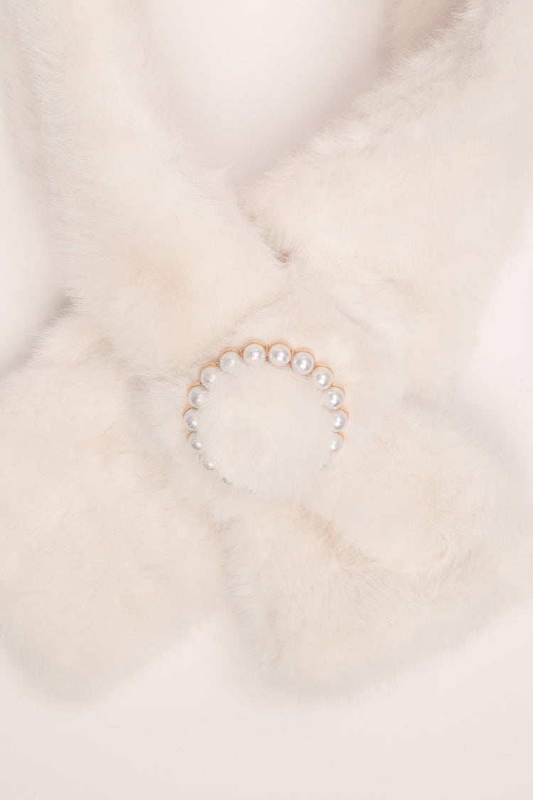 Ivory plush neck warmer with round beaded buckle