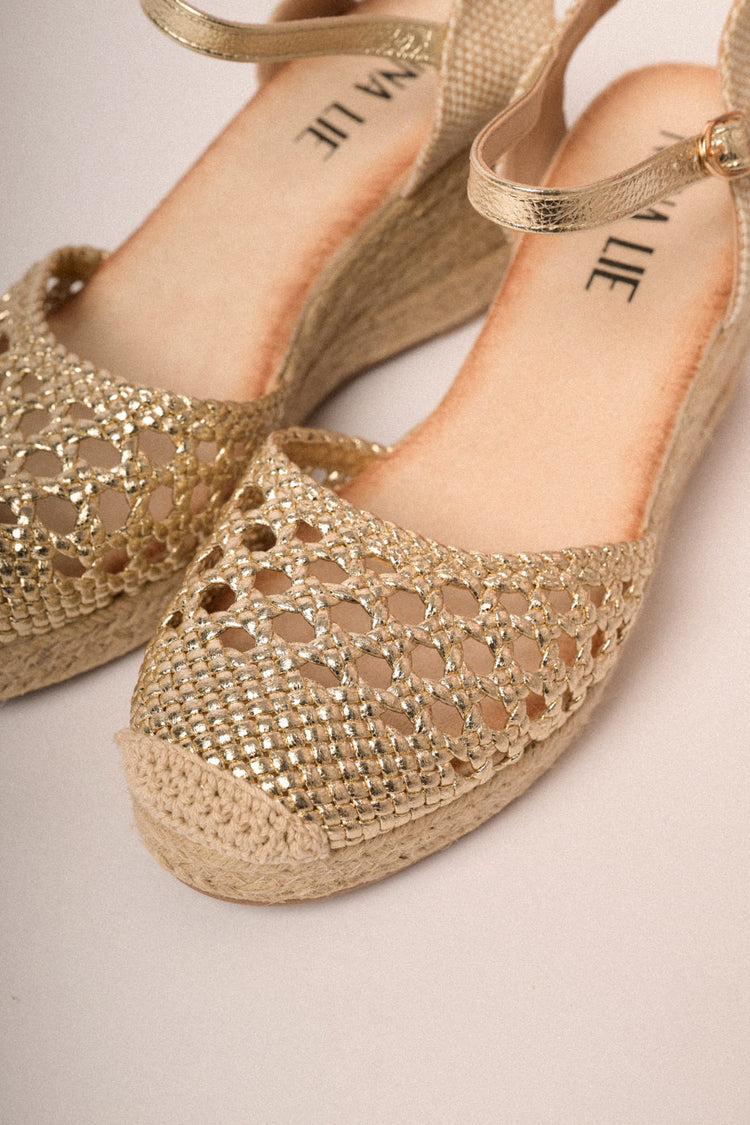 Golden woven raffia espadrilles