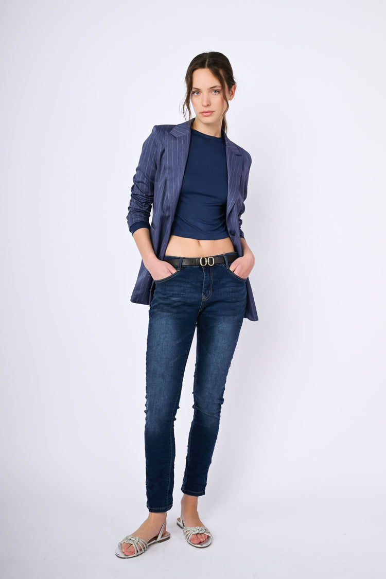 Belted skinny jeans