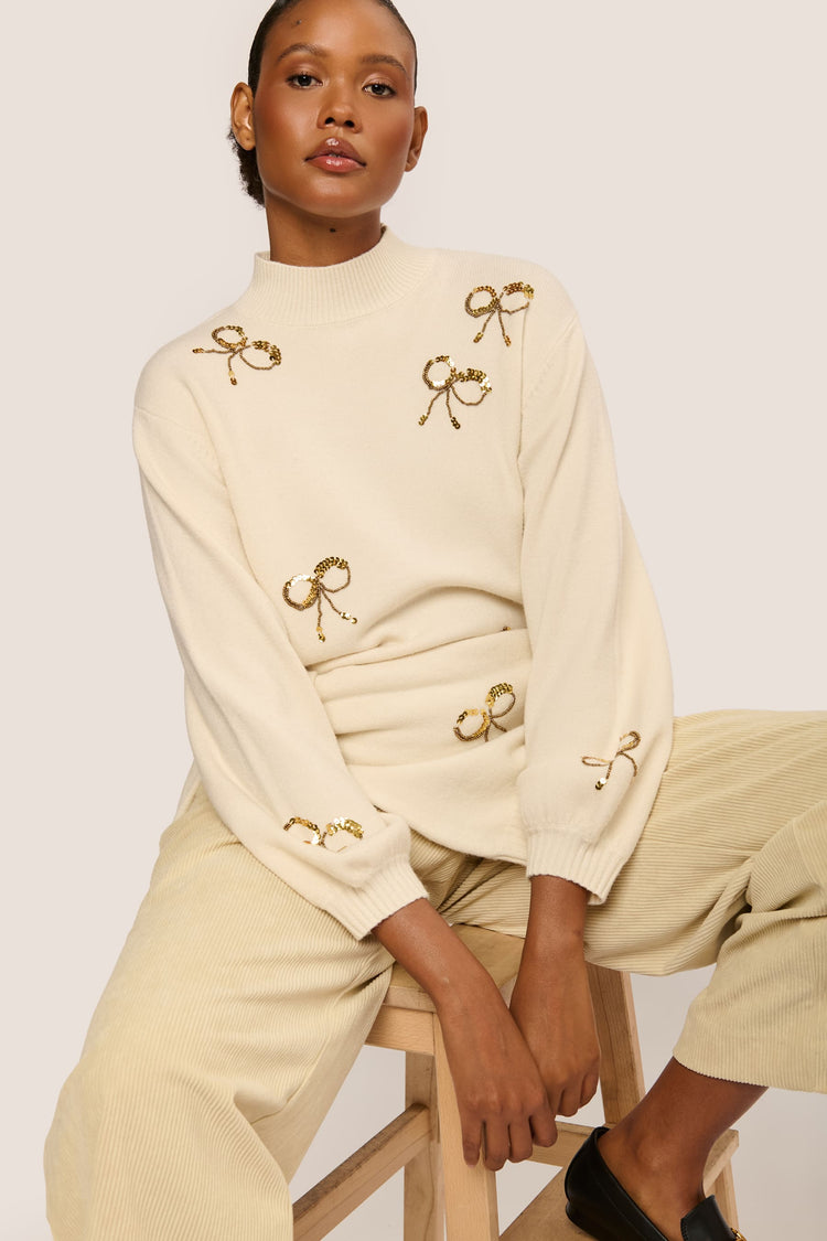 Sequin bows mock sweater