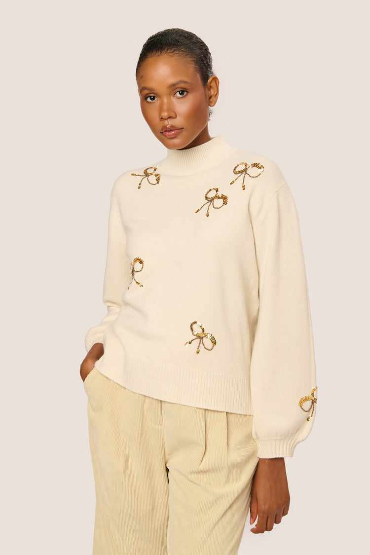 Sequin bows mock sweater