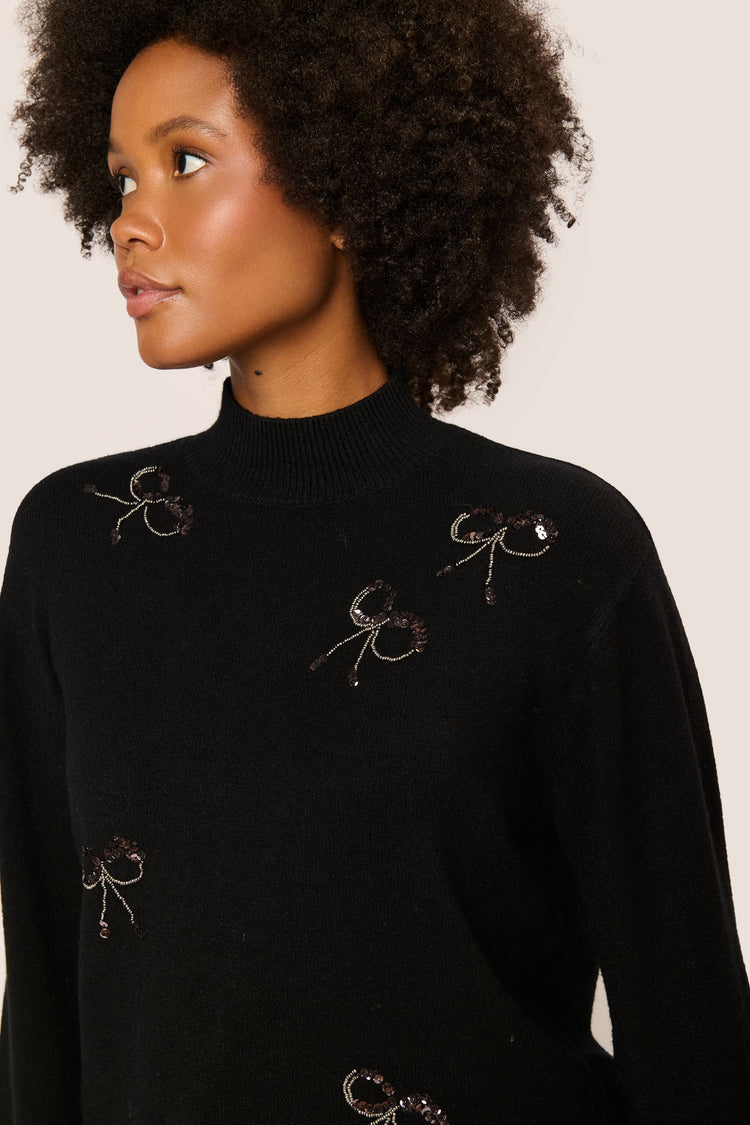 Sequin bows mock sweater