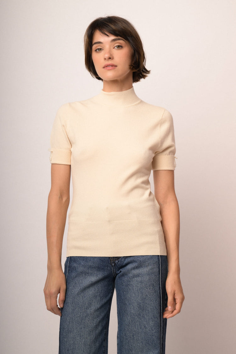 Maglia con fiocco perline manica
