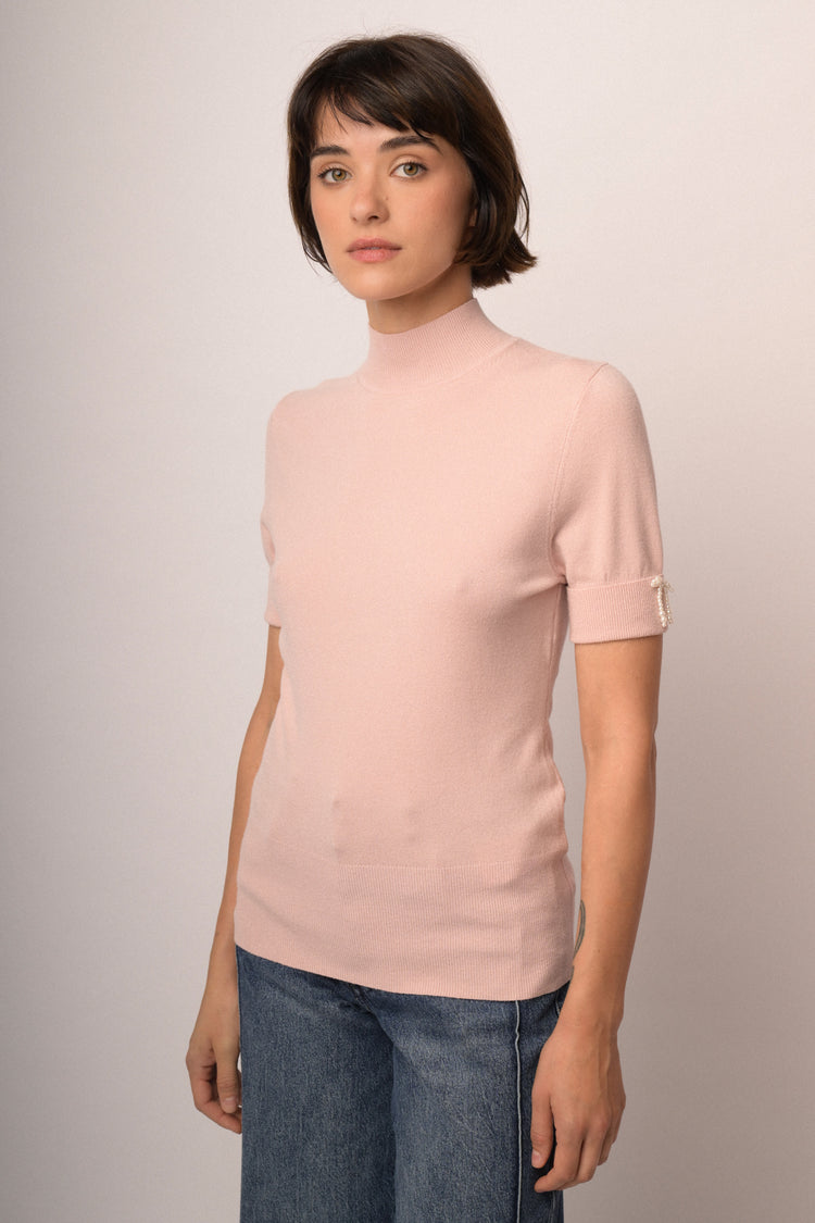 Maglia con fiocco perline manica