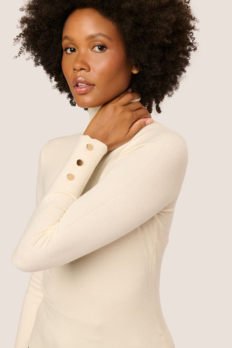 Buttoned cuff turtleneck