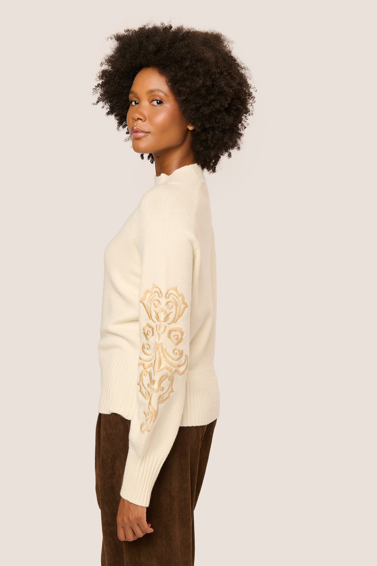 Embroidered sleeves mock sweater