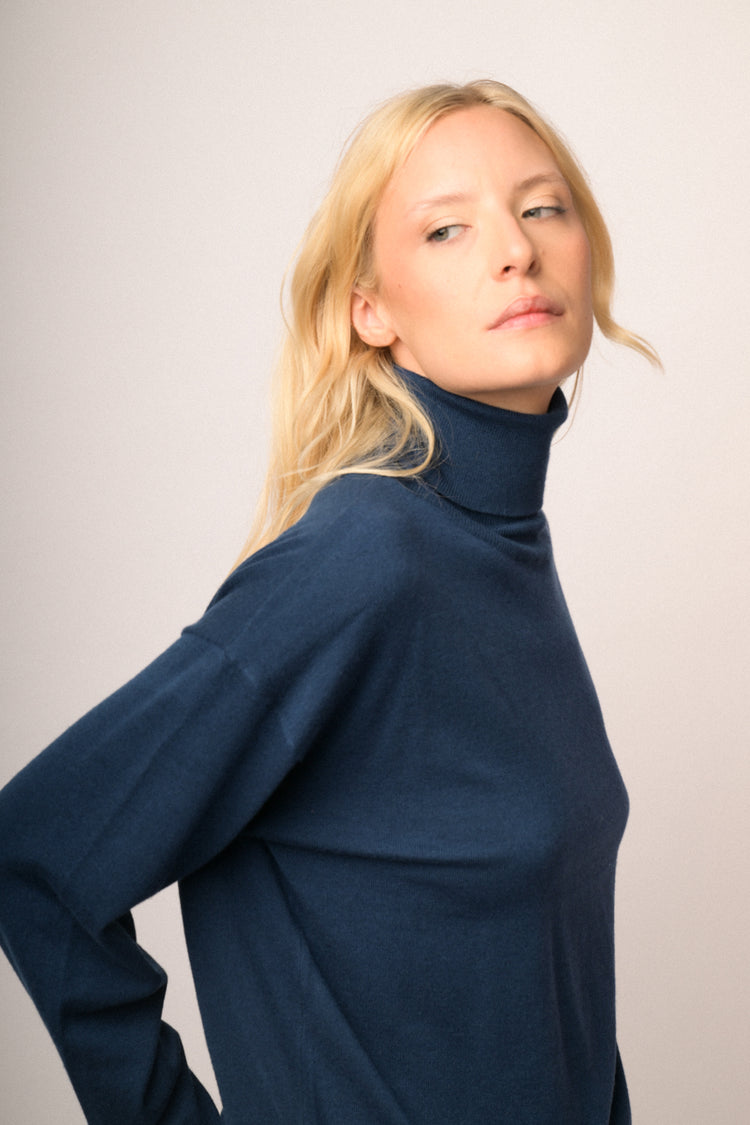 Jewel-button cuffs blue knit turtleneck