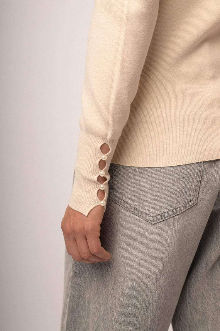 Maglia shiffer con fiocchi perline