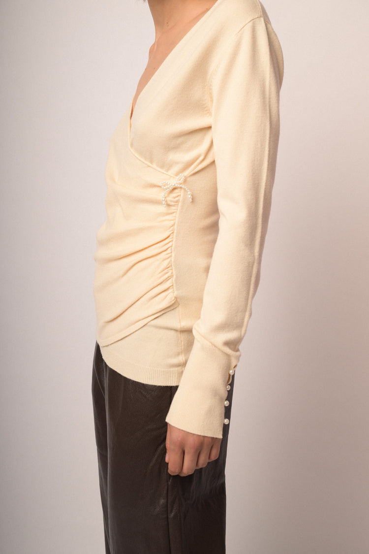 Maglia incrocio con fiocchi perline