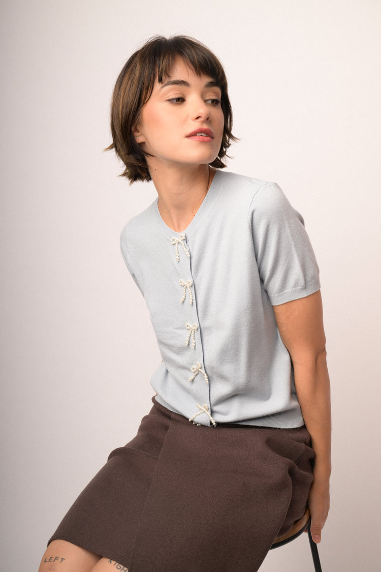 Sky-blue short-sleeved cardigan with beaded bows