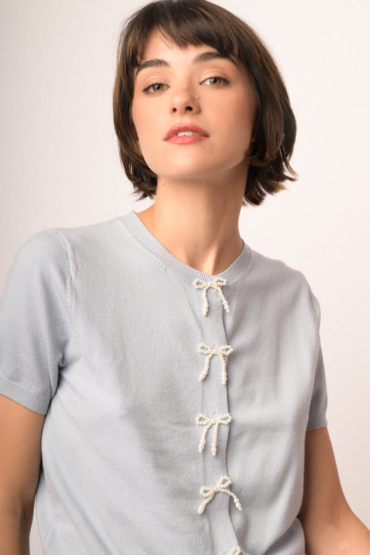 Sky-blue short-sleeved cardigan with beaded bows
