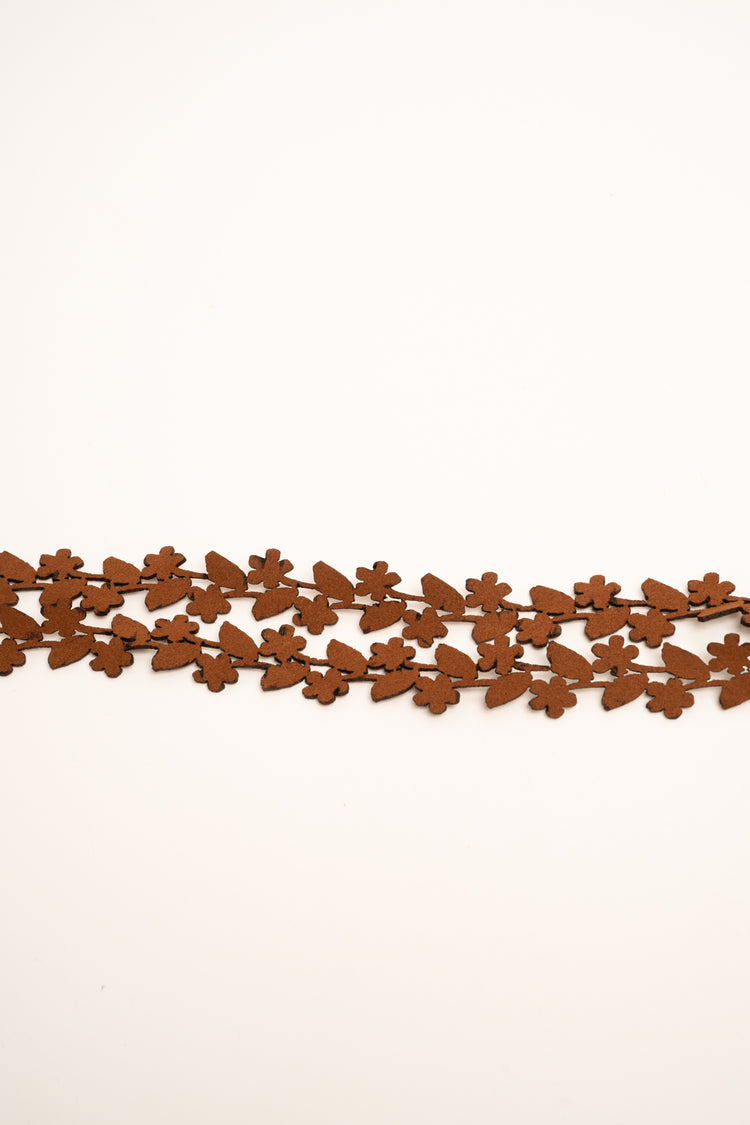 Fringed tassels and floral motif tan faux suede slim belt