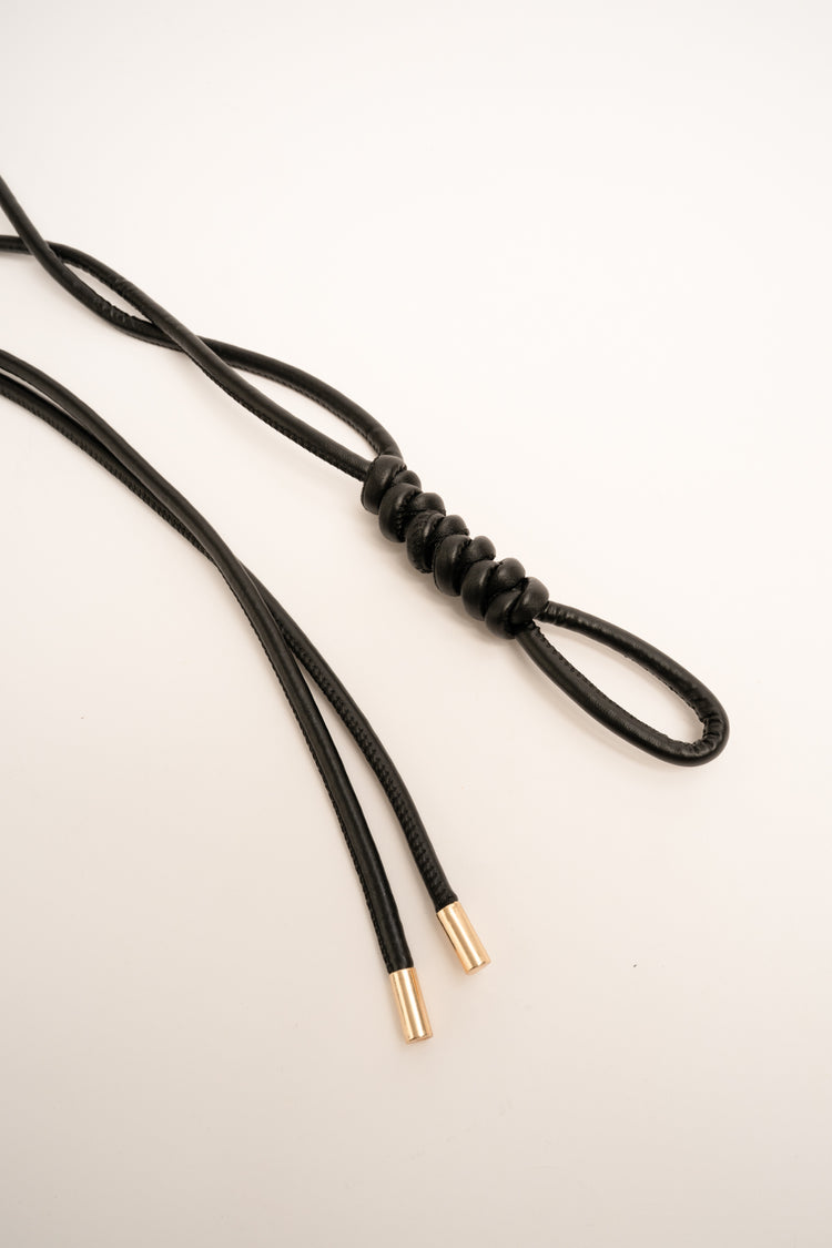 Black knotted sash belt
