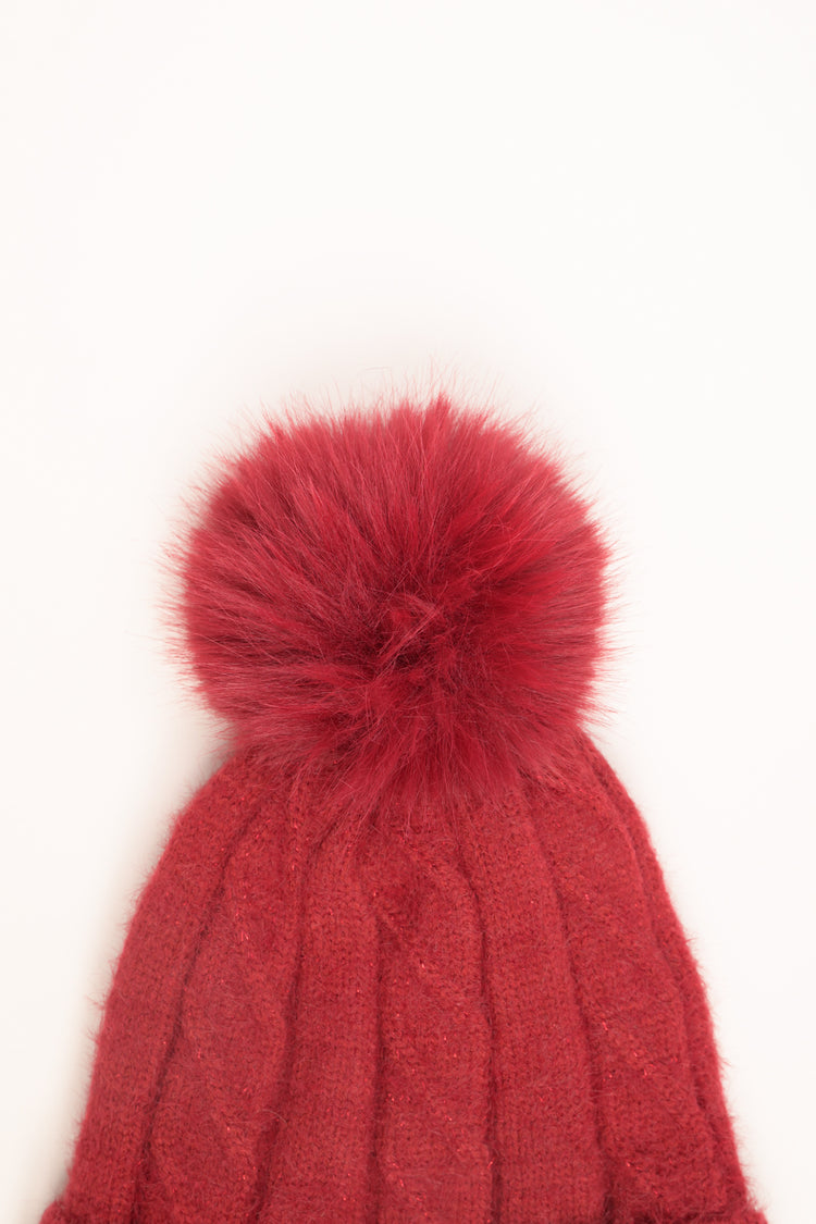 Burgundy cable-knit hat with pom-pom