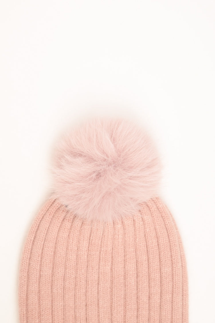 Pink rib-knit hat with pom-pom