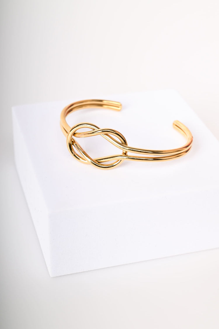 Woven rigid bracelet